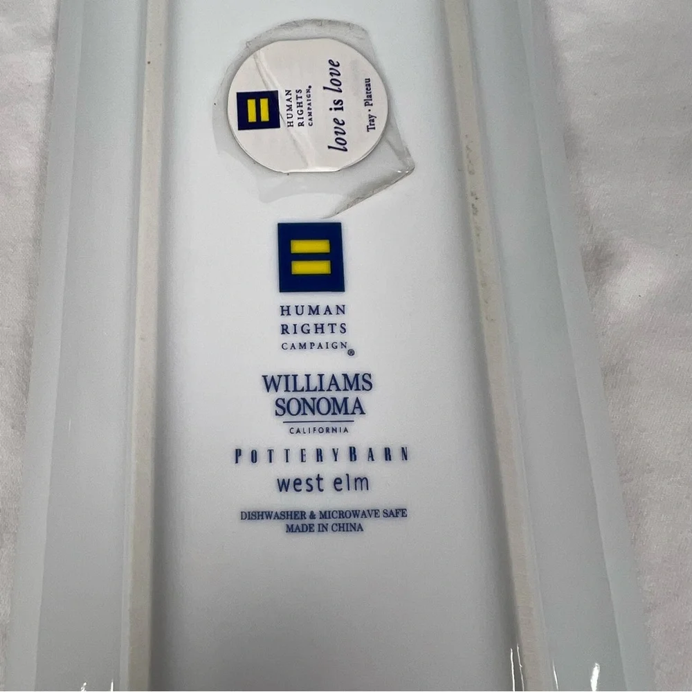 Williams Sonoma Love is Love tray with gold trim and multicolored hearts.